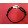 Bracelet Dinh Van Menottes R12 sur cordon noir